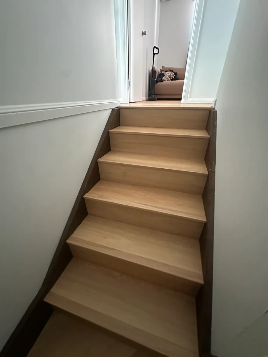 Plank flooring laid on Richlands stairs with custom matching nosings