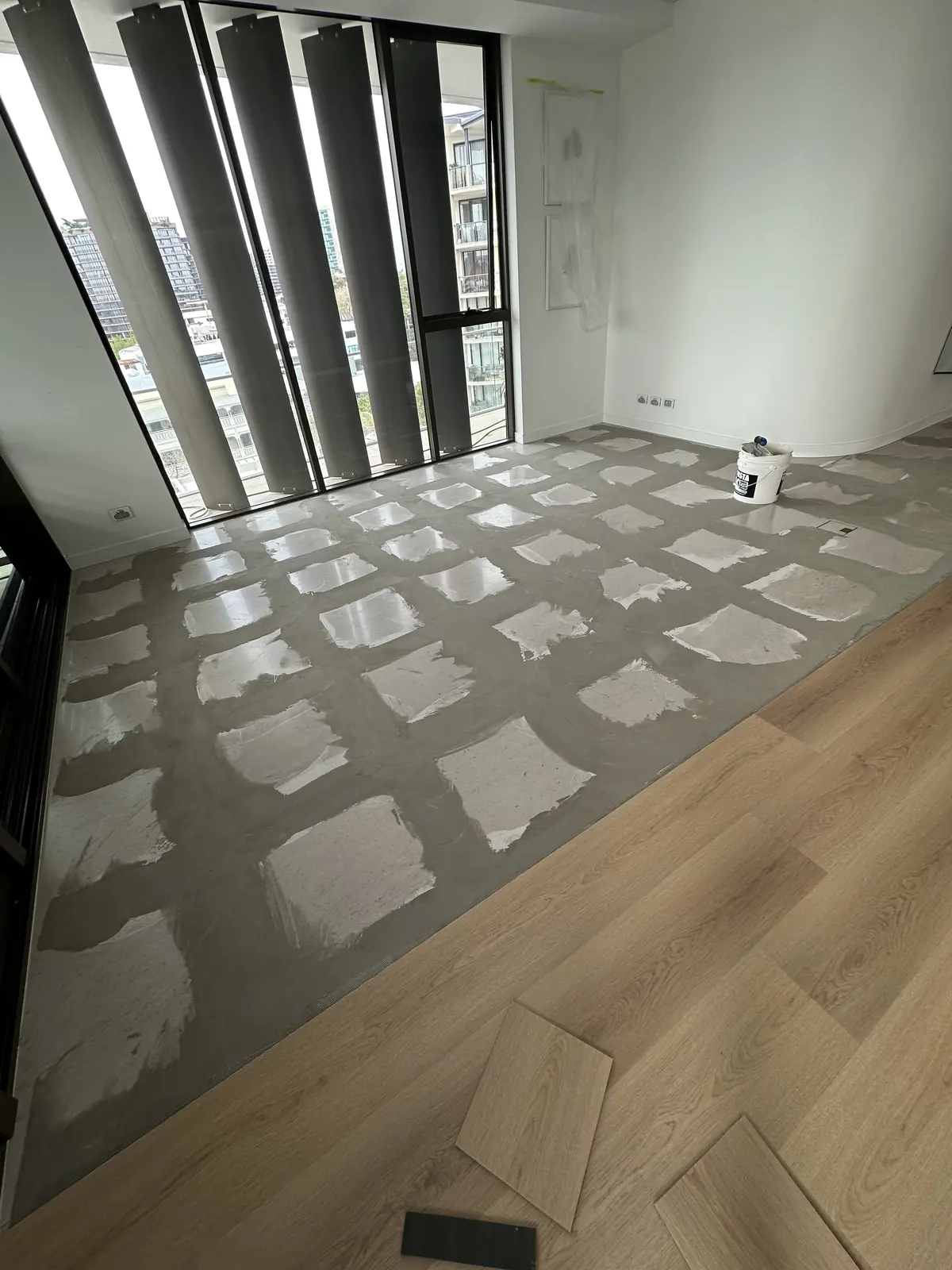 Toowong apartment concrete slab patched and prepared before plank flooring installation
